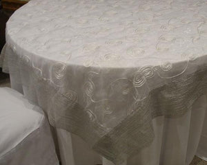 White on white sheer swirl pattern with a mettalic silver trim. 85" Square Sheer with Satin Trim